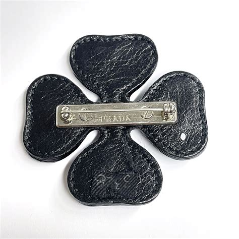 prada leather pin